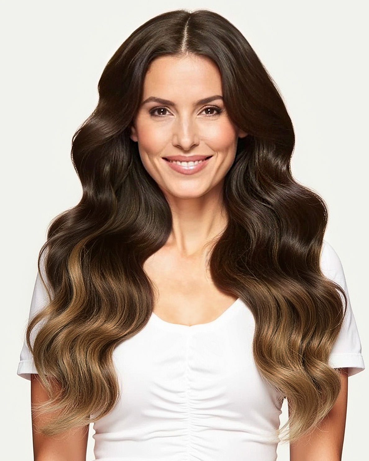 woman wearing irresistible me brown melt clip in hair extensions