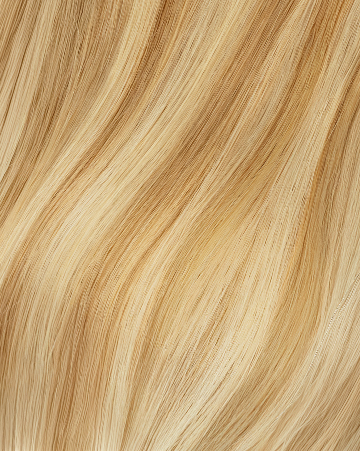 tape-in hair extensions golden highlights.