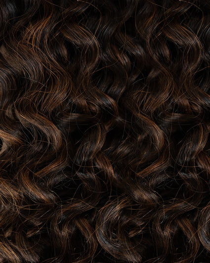 curly invisible tape-in hair extensions mocha balayage.