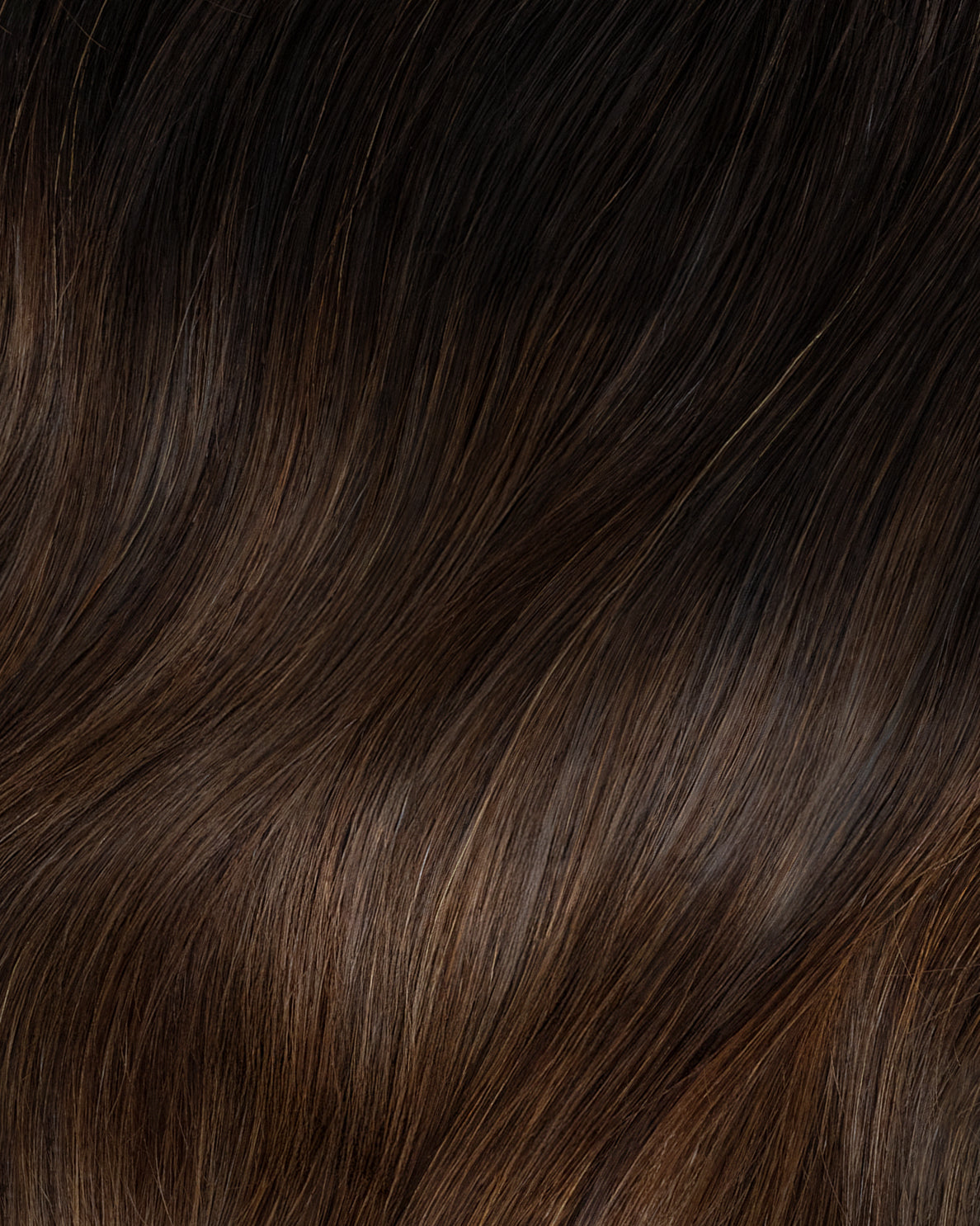 invisible clip-in hair extensions dimensional brown.