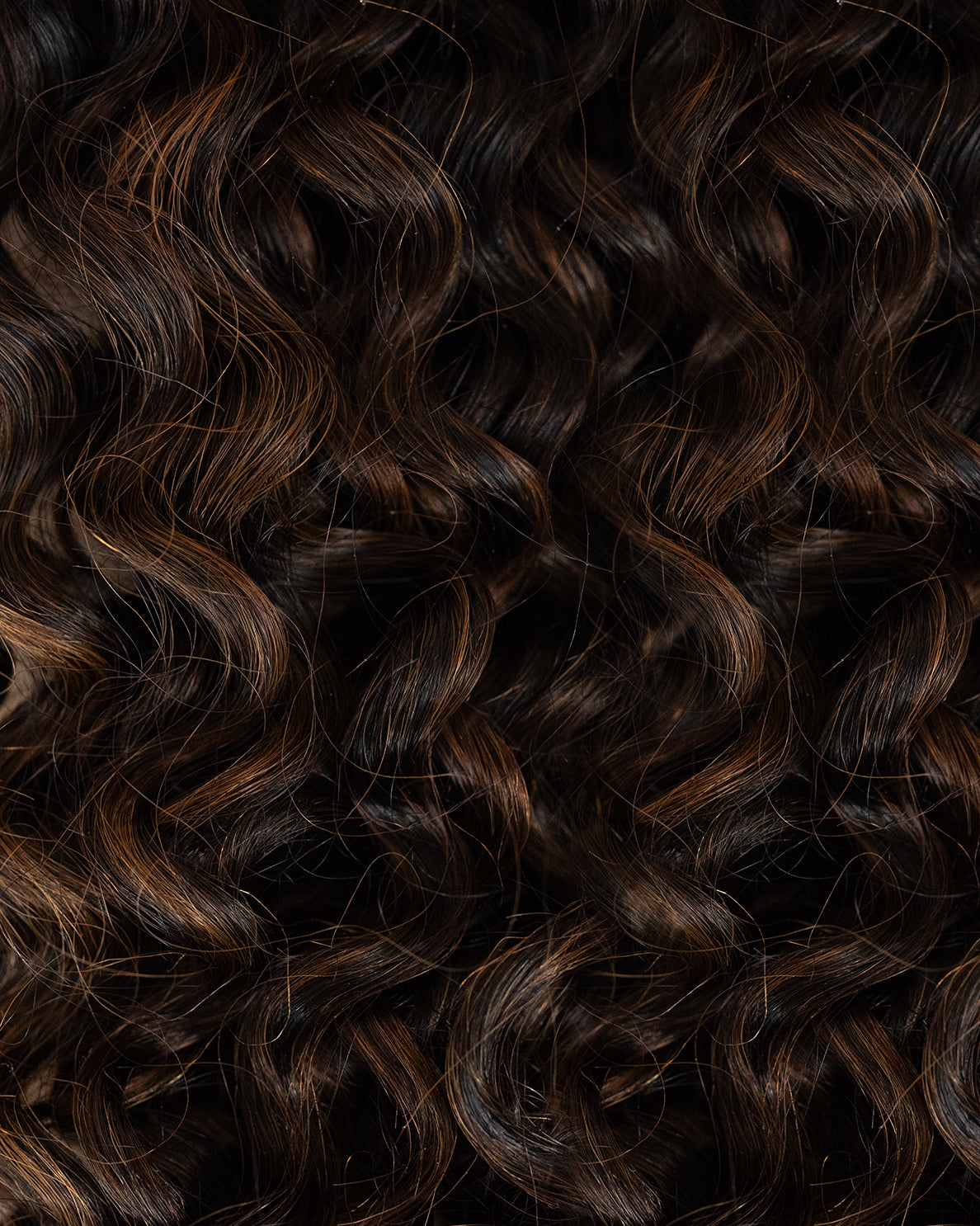 curly (3A curls) clip-in hair extensions mocha balayage.