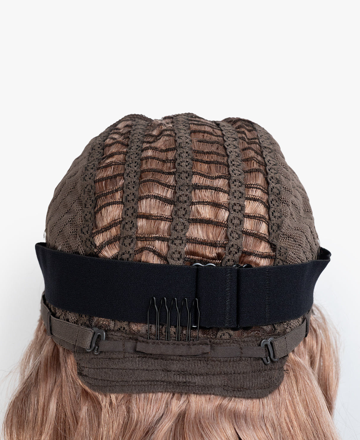 Brown lace wig cap with a black band on a white background