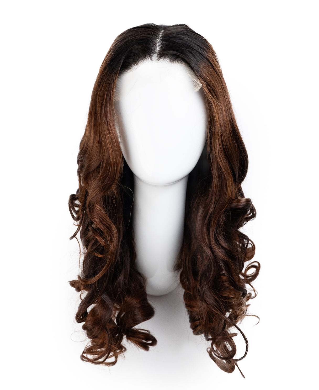 Brown wig on a mannequin head against a white background