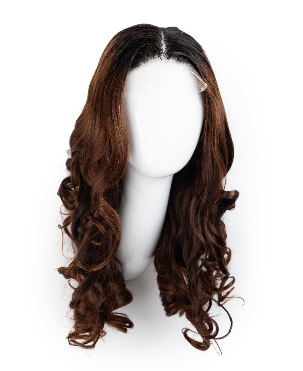 Brown wig on a mannequin head against a white background