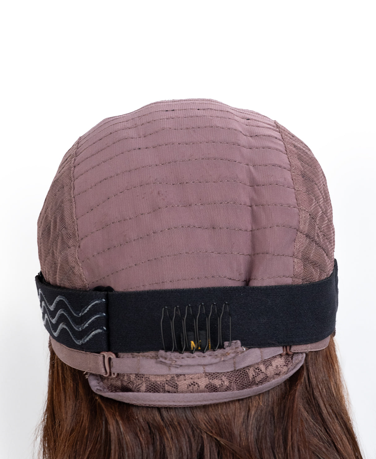 Brown wig cap with a black headband on a white background
