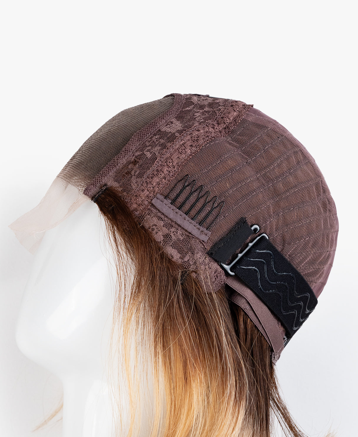 Brown cap with lace front on a mannequin head against a white background