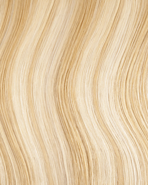 tape-in hair extensions golden highlights.