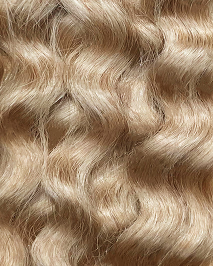 curly invisible tape-in hair extensions honey blonde.