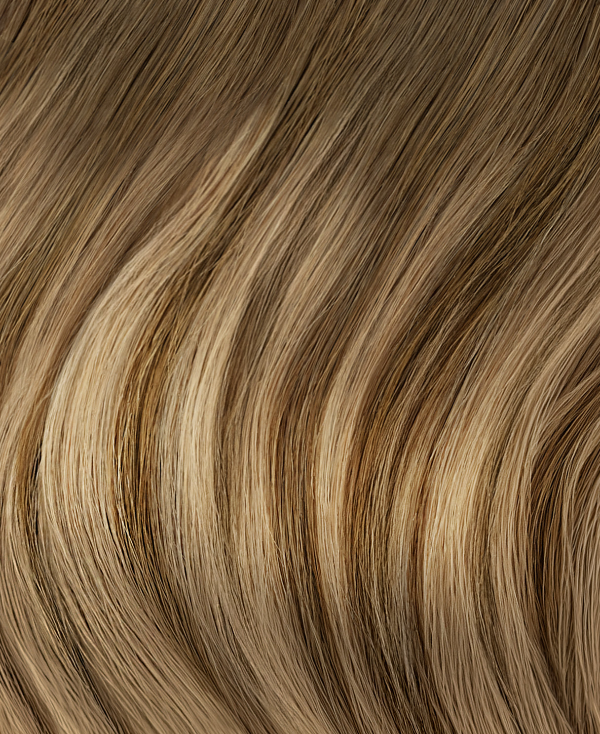 tape-in hair extensions teddy blonde balayage.