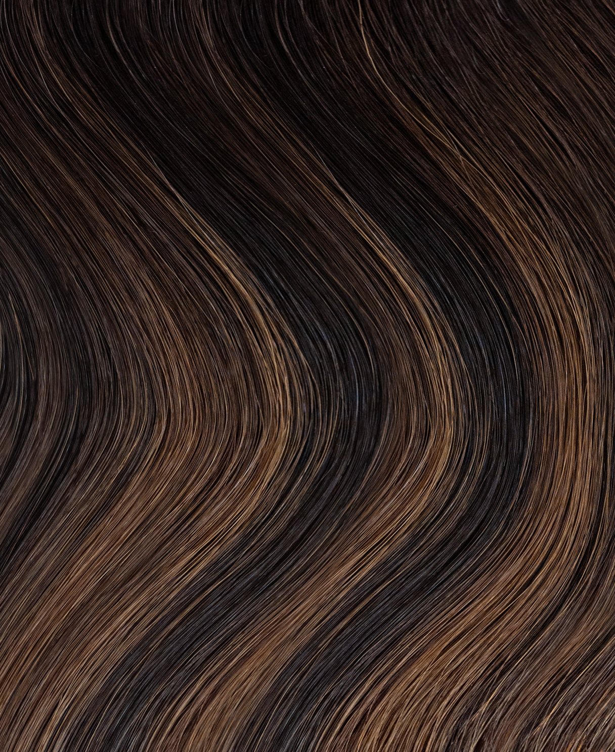 tape-in hair extensions mocha balayage.