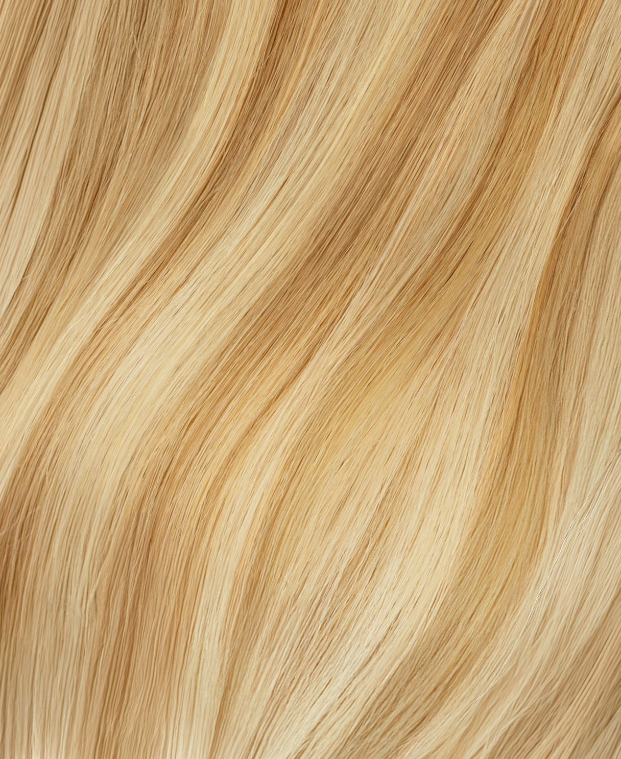 tape-in hair extensions golden highlights.