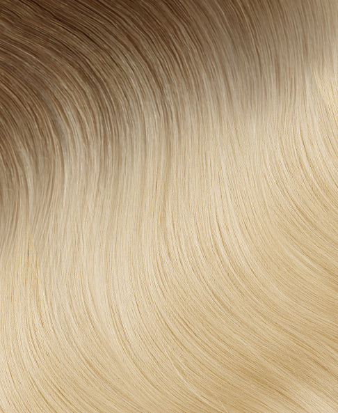 invisible clip-in hair extensions rooted blonde.