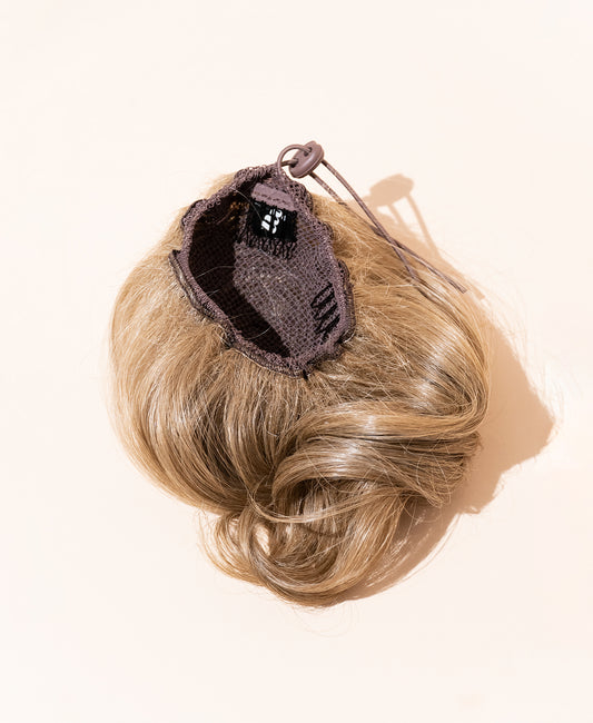 messy bun - ash blonde.