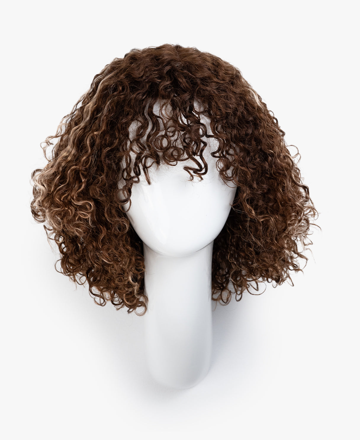 Brown curly wig on a mannequin head against a white background