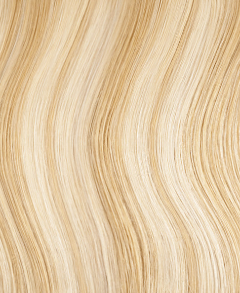 invisible clip-in hair extensions golden highlights.